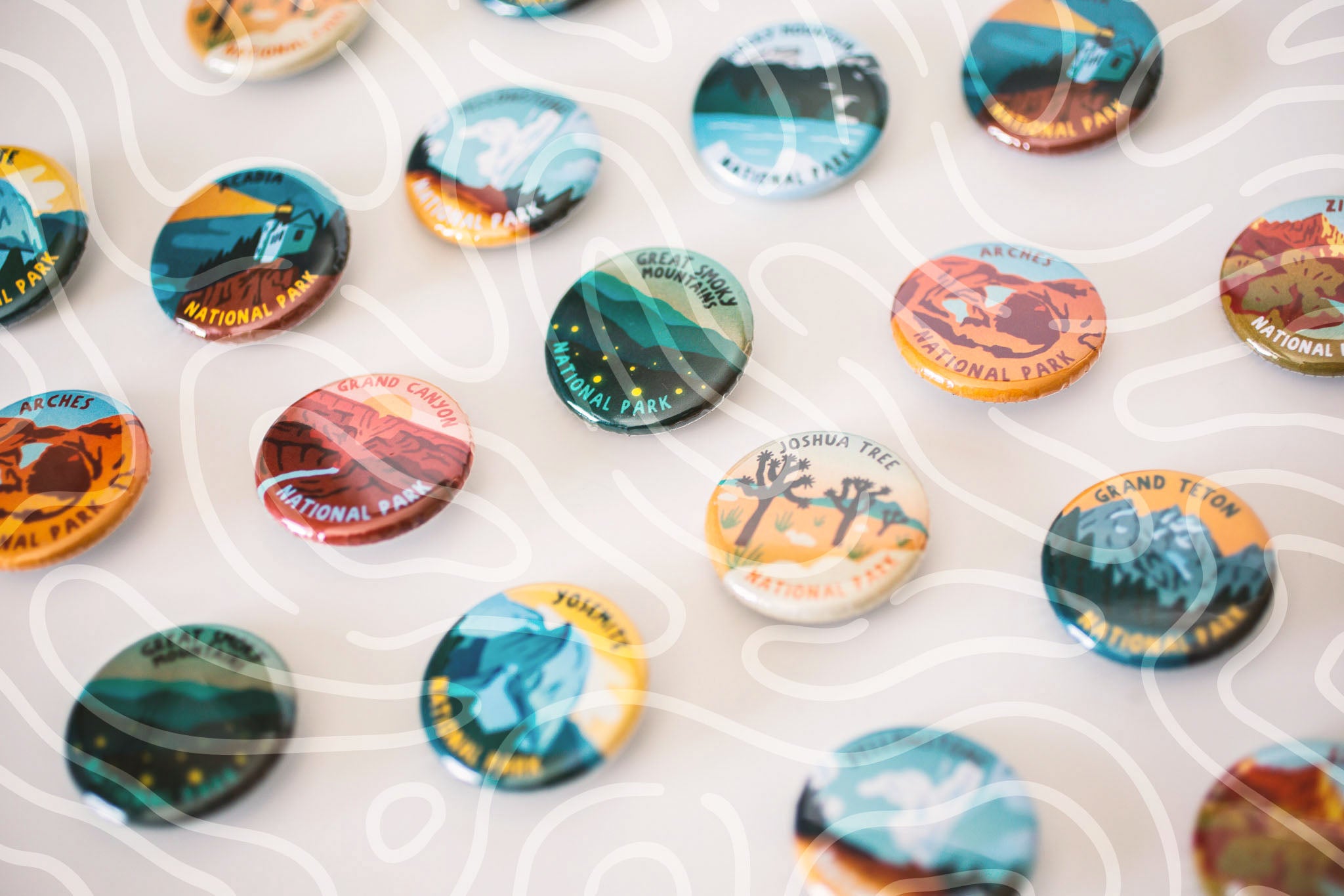 New: Merit Badge Series Button Images with a topographic wave graphic overlay
